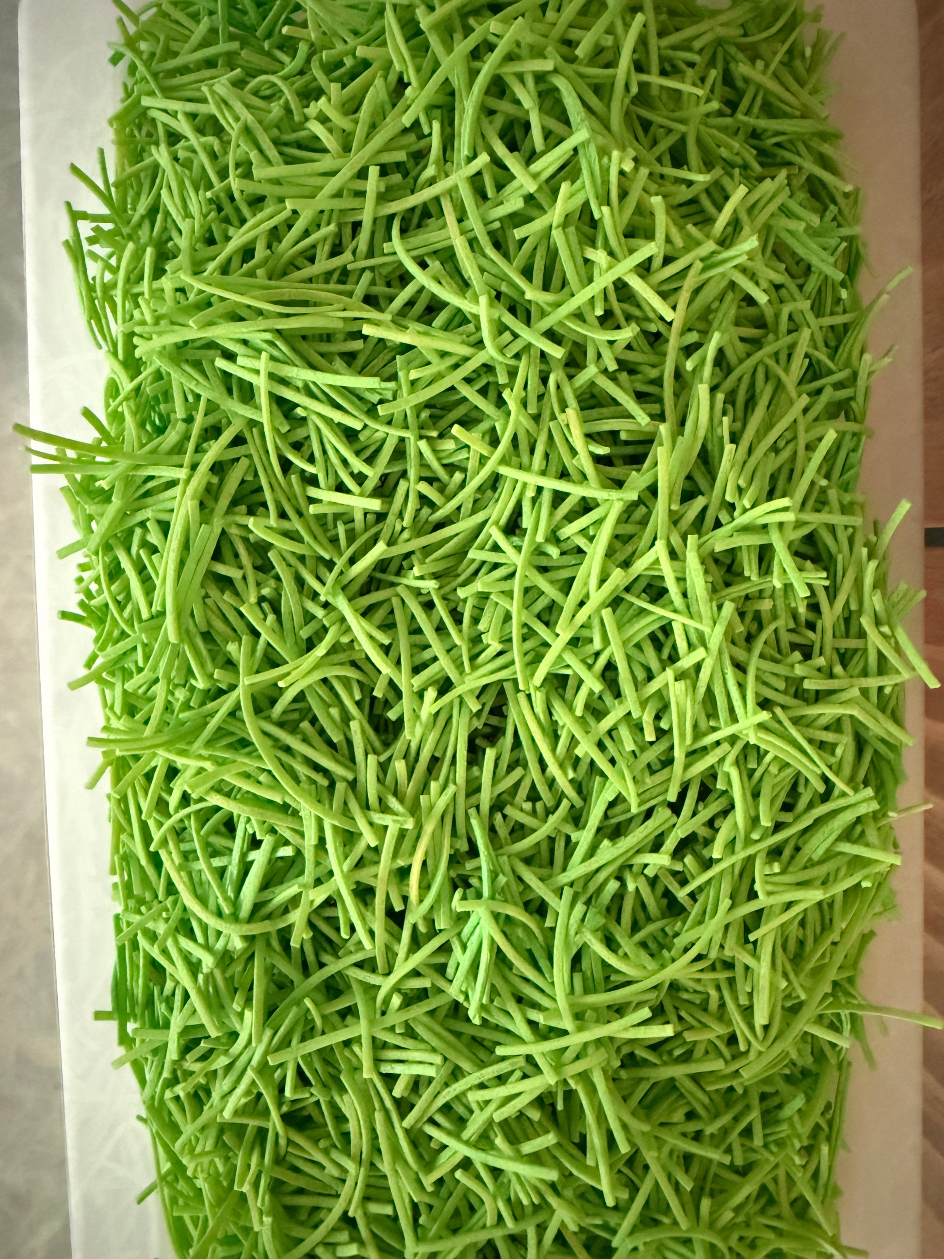 Green “grass” sensory bin filler